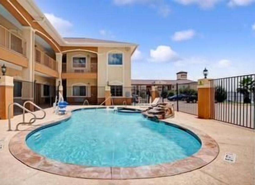 Outdoor swimming pool and courtyard at Crystal Inn Houston