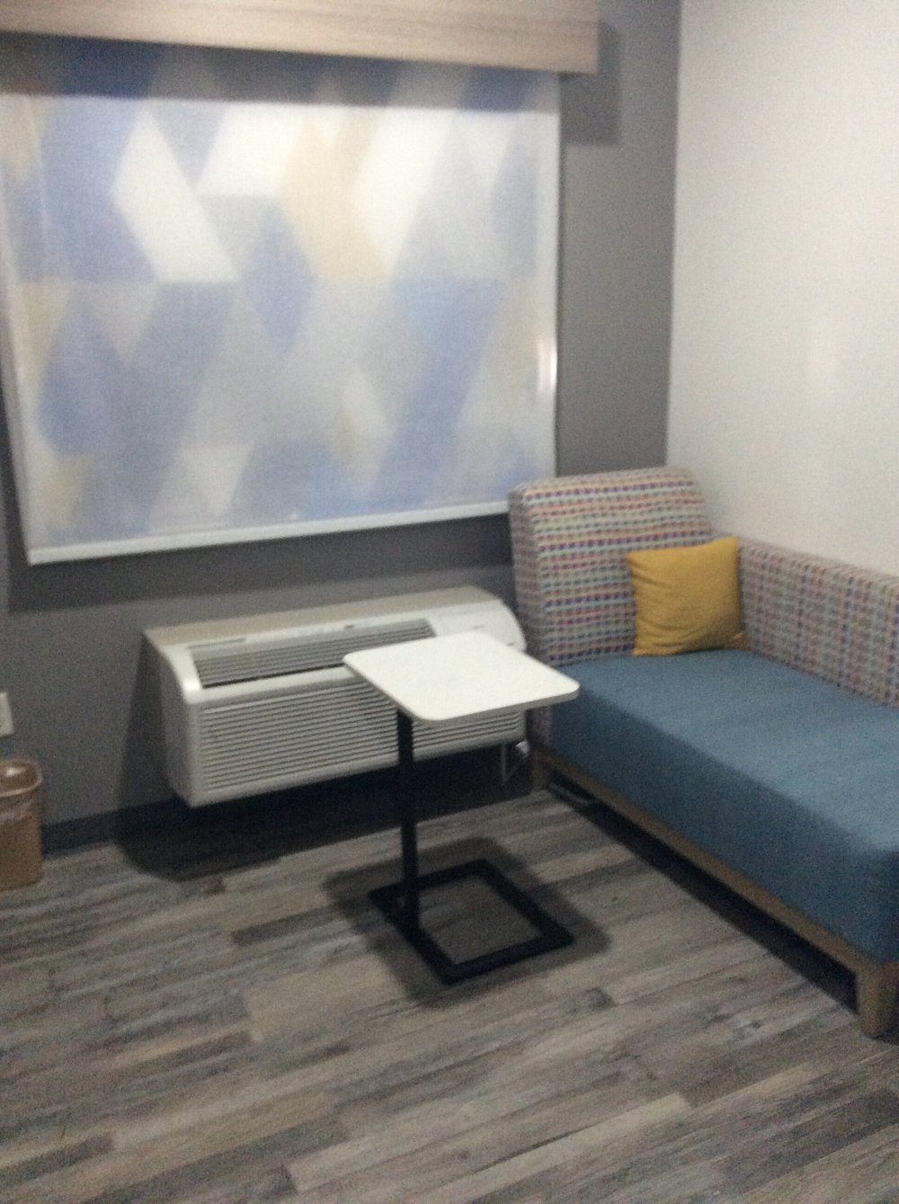 Guest room seating area with day bed and work table